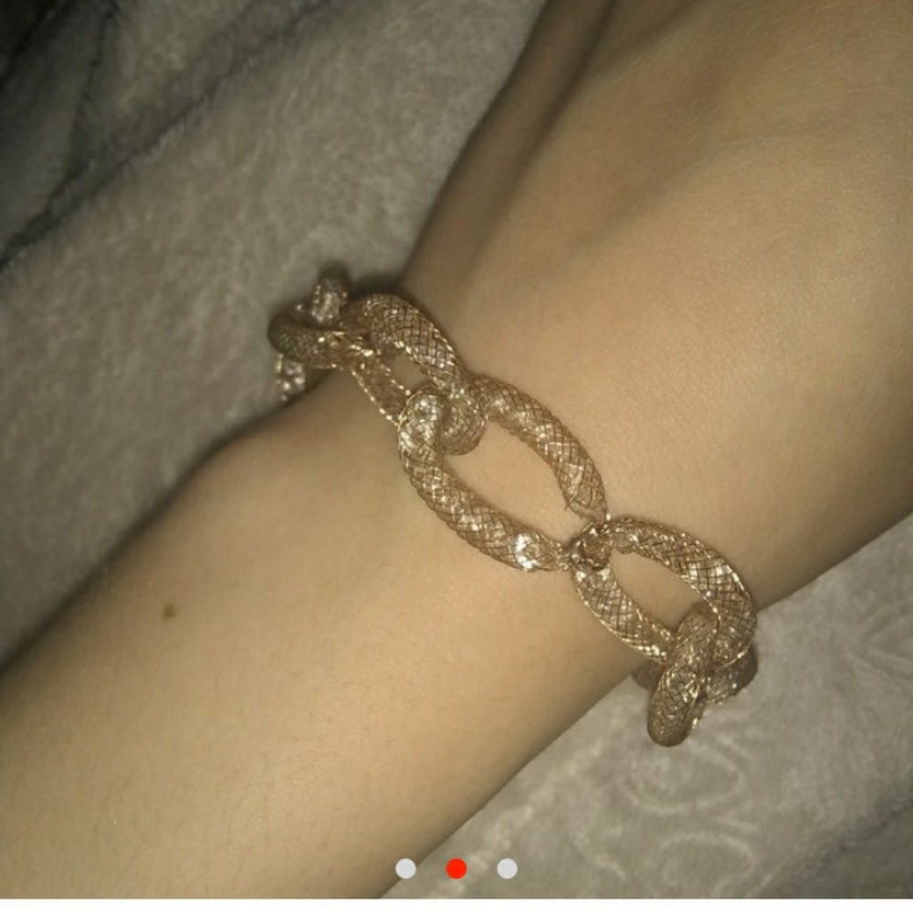 Gold plated bracelet with diamonds inside